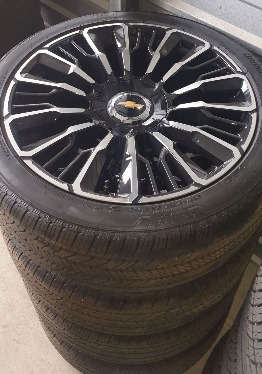 Chevy Tahoe 24-inch wheels and 285/40R24 tires for sale in Reno, NV. Factory take-offs with just 25 miles. Wheel part number 84949571. Offers welcome.